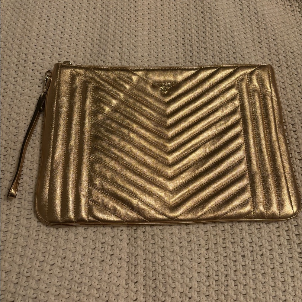 Michael kors large clutch w strap gold never used approximately 14’ x 9’